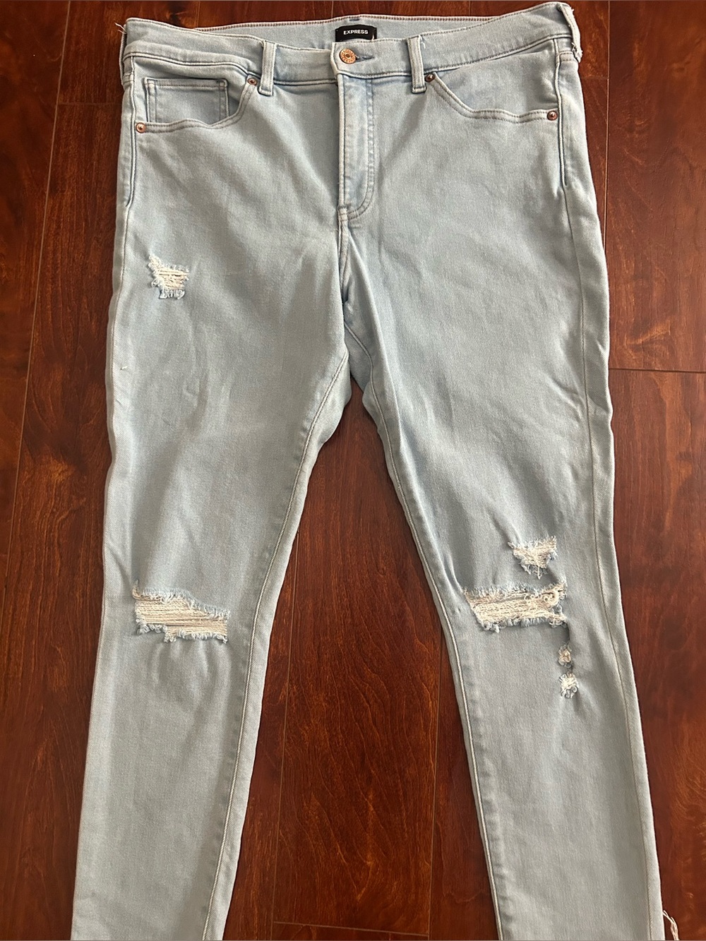 Express Women's Skinny Jeans in Light Blue with Distressed Knees